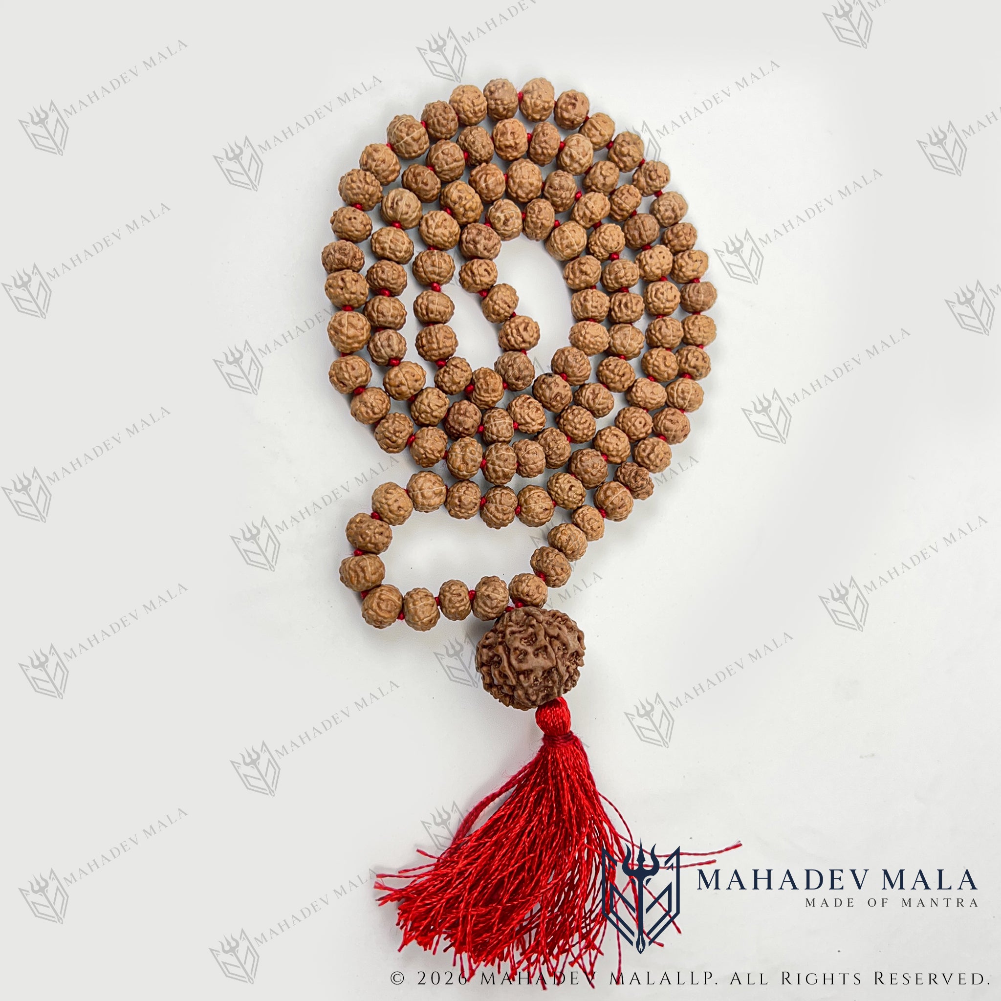 Coiled 7 Mukhi Rudraksha Japa Mala with red tassel and Nepali Guru bead